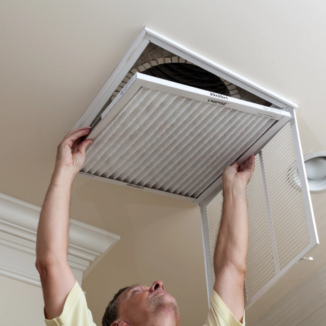 man cleaning duct