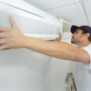 man installing ac